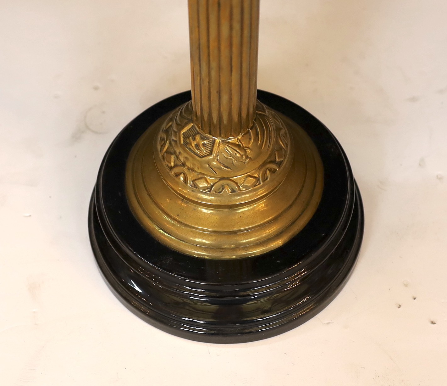 A late Victorian brass oil lamp with cut glass reservoir, duplex mechanism, etched glass globe and flue, height overall 68cm